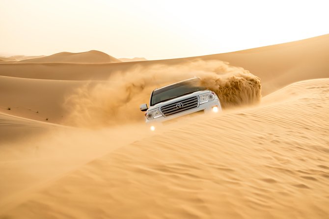 Sunrise Desert Safari from Abu Dhabi - Sand boarding with help when needed