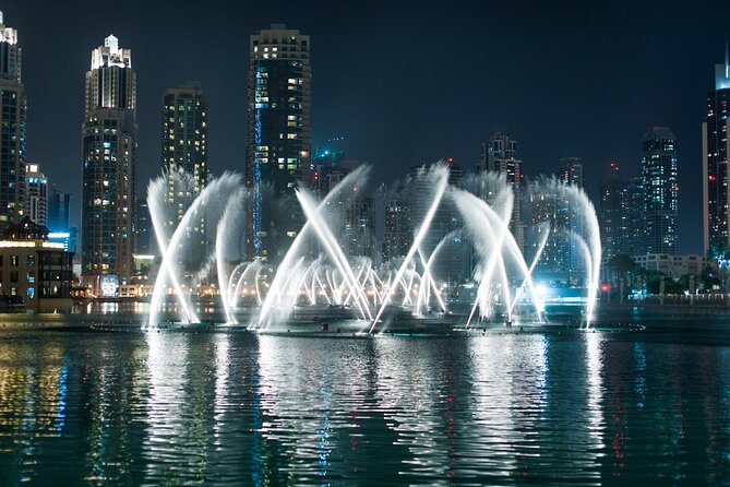 Traditional Abra Ride and Dubai Fountain Show at Burj Lake - Burj Khalifa and Downtown Dubai after sunset