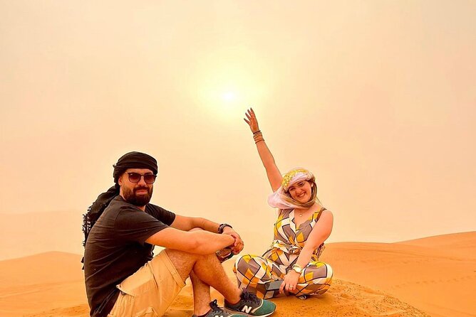 VIP Dubai Desert Safari with Quadbike,Sandboarding & BBQ dinner - Camel rides and sunset photographs at the camp