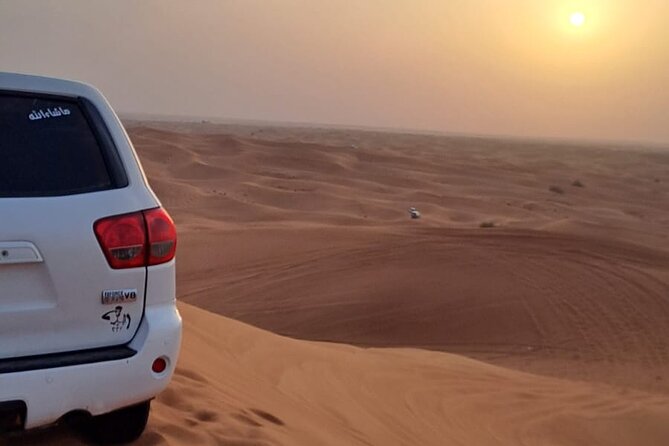 VIP Dubai Desert Safari with Quadbike,Sandboarding & BBQ dinner - Tanura, belly dance, and fire after dark